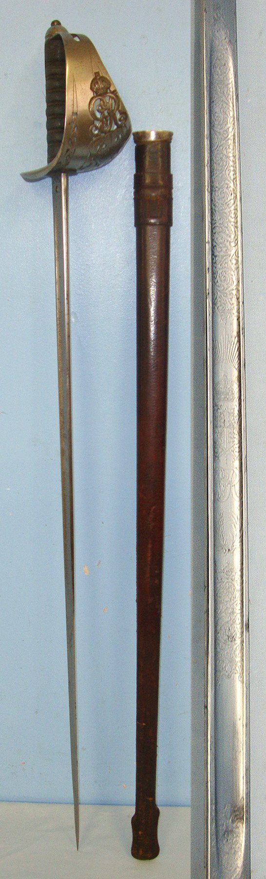  WW1 Era British WD 1897 Pattern Henry Wilkinson London Infantry Officer’s Sword With King George V Guard, Etched Blade Number 46608 & Leather Covered Field Service Scabbard. Sn 23633:5  Sword