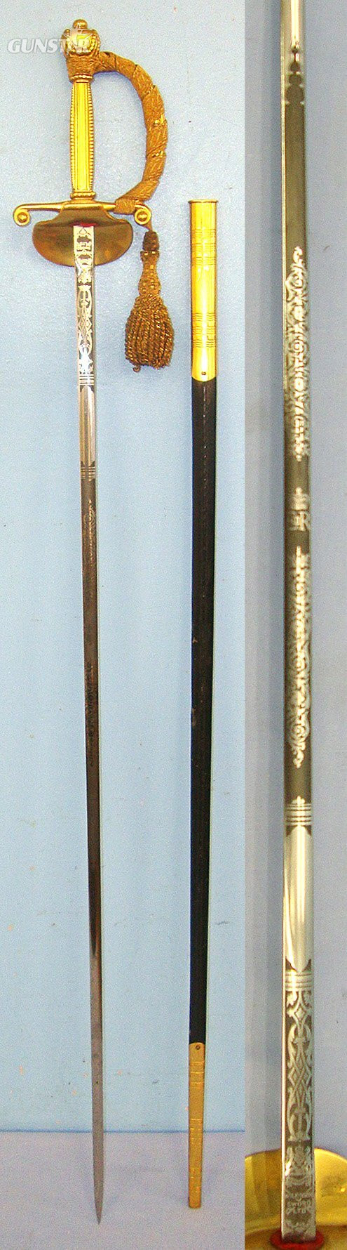  MINT**Post 1952 British Wilkinson Sword Ltd QE II Royal Household Clam Shell Court Sword With Blued & Etched Panels Blade, Gilt Hilt Fitted With Bullion Cord & Portepee & Scabbard. Sn 23573 Sword