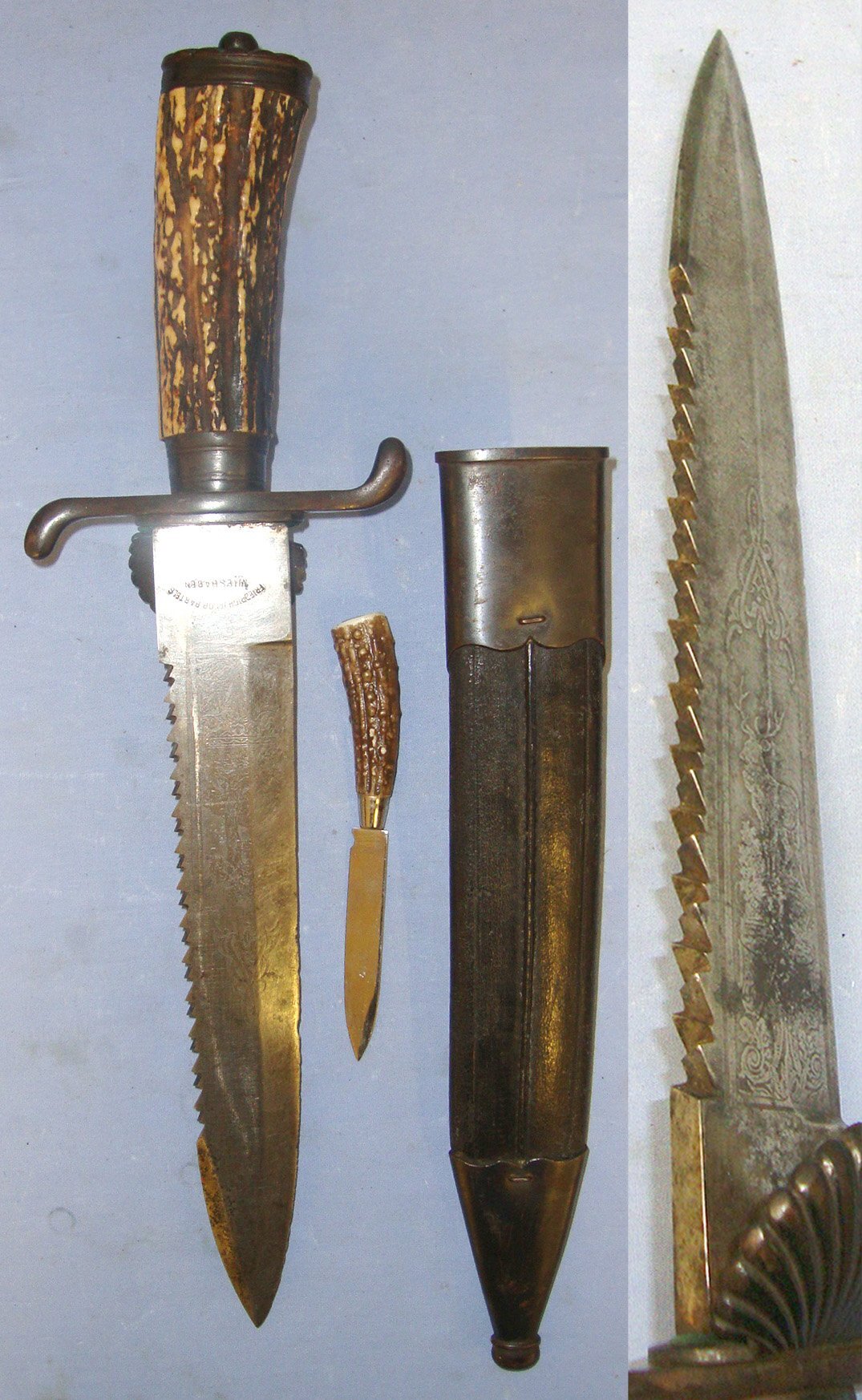  RARE**QUALITY**Late 19th Century Imperial German ‘Friedrich Jacob Bartels Wiesbaden’ Clamshell Boar & Stag Hunting Dagger / Dirk / Sidearm With Hunting Scenes Etched Sawback Blade, Stag Antler Hilt & Original Steel Mounted Leather Scabbard With Skinne Hunting Knive