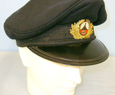 original manufacturer’s label printed in red on a clear cellophane panel togethe Alte Kameraden (Old Comrades) Dark Blue Cloth Visored Cap With Manufacturer’s La Clothing