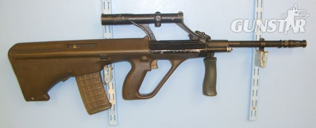 Steyr 1990’s Austrian Steyr Licenced Malaysian SME Ordnance Company (SMEO) AUG A1 5.56mm Calibre Assault Rifle with Integral Swarovski Optik1.5 X Magnification Telescopic Sight. **UK/EU DEACTIVATION CERTIFICATED** Sn 18261. Semi-Auto 5.56x45mm NATO (.223 Remington) Rifle in 
