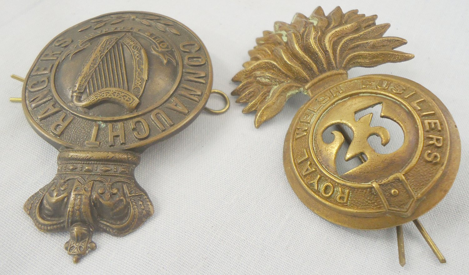 Pair* Royal Welsh Fusiliers 23rd Regiment and Connaught Rangers Glengarry Cap Badges. 22434:15. Pair* Royal Welsh Fusiliers 23rd Regiment and Connaught Rangers Glengarry Cap Badges. 22434:15.  Antique & Militaria