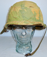 American Vietnam War Period M1 Combat Helmet, Liner, & Camouflage Cover. HE 842. American Vietnam War Period M1 Combat Helmet, Liner, & Camouflage Cover. HE 842. Clothing