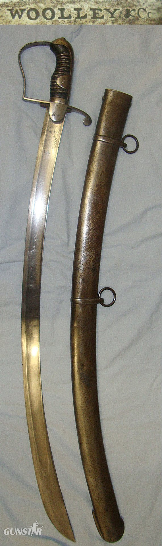 NAPOLEONIC WARS ERA**MATCHING MAKER**Georgian British 1796 Pattern Officer's Private Purchase Quality Light Cavalry Sword By Woolley & Co Birmingham & Scabbard By Woolley & Co Birmingham. Sn 23174:27 Sword in 
