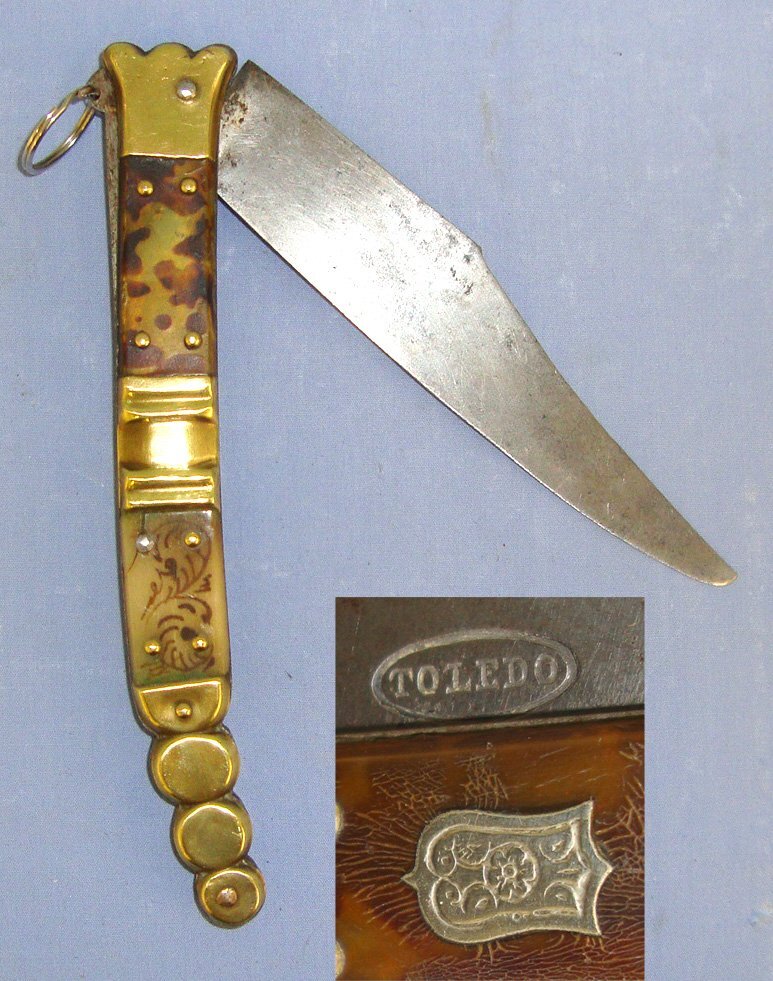 QUALITY**19th Century Spanish Toledo Steel Navaja Folding Fighting / Utility Knife With Sharp Scimitar Form Blade Marked ‘Toledo’, Hand Decorated Polished Horn & Brass Section Scales. Sn 21966:3 Knive