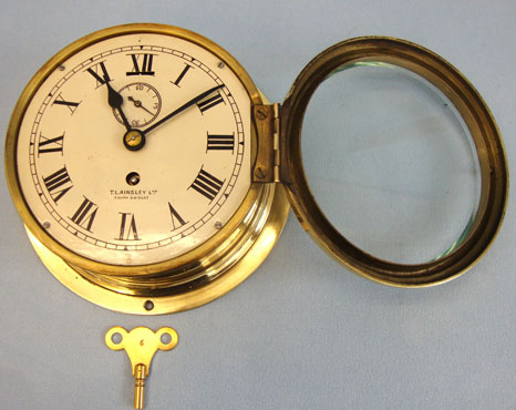 T. L. Ainsley Ltd. South Shields, England. Ship\'s Brass Bulkhead Clock With 60 Seconds Time Keeping Feature and Key By T. L Other Accessory