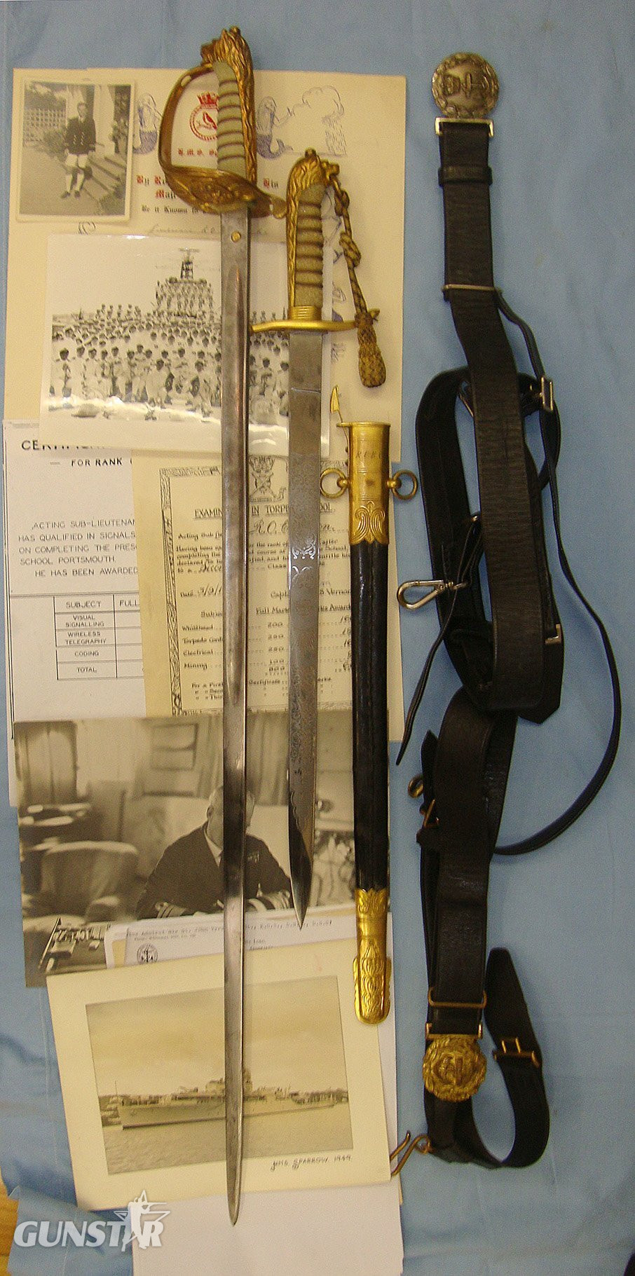 NAMED**WW2 British Royal Navy Officer’s 1827 Pattern George VI Sword With Etched Blade, Dirk By Gieves With Cord & Portepee, Scabbard With Belts By Gieves & Hanging Straps. The Sword & Dirk Marked To RN Commander R.O.E. Caton With Dossier Of Documents   Sword