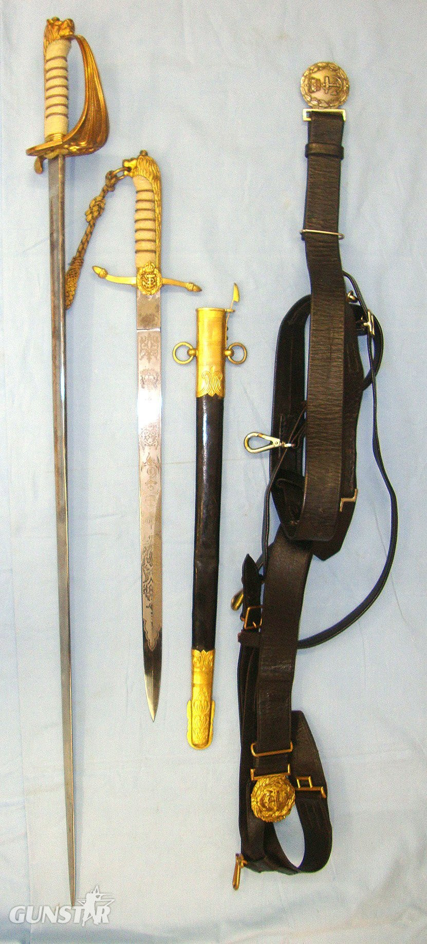  NAMED**WW2 British Royal Navy Officer’s 1827 Pattern George VI Sword With Etched Blade, Dirk By Gieves With Cord & Portepee, Scabbard With Belts By Gieves & Hanging Straps. The Sword & Dirk Marked To RN Commander R.O.E. Caton With Dossier Of Documents   Sword