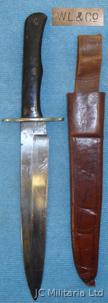 An Officers WWI ‘W.L. & Co – Private Purchase ‘Shikar Knife’ and Leather Sheath. Bayonet in 