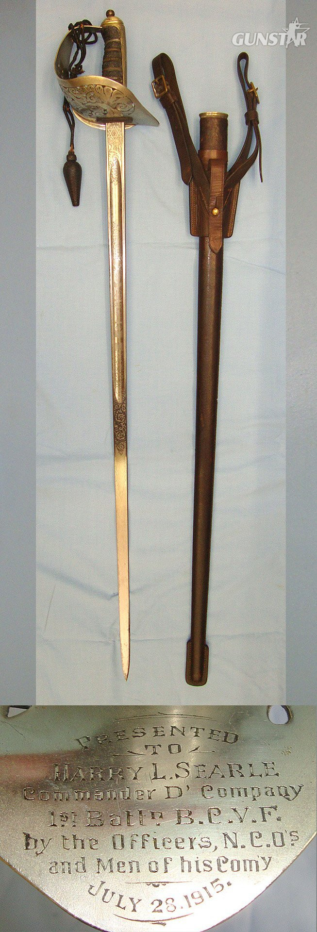 NAMED**British WD WW1 1915 George V 1897 Pattern British Fenton Brothers Sheffield Presentation Sword With Blued & Etched Blade To ‘Harry L. Searle, Commander D' Company, 1st Battn. B.C.V.F, Cord, Acorn Knot & Leather Field Scabbard & Sam Browne Frog. S Sword in 