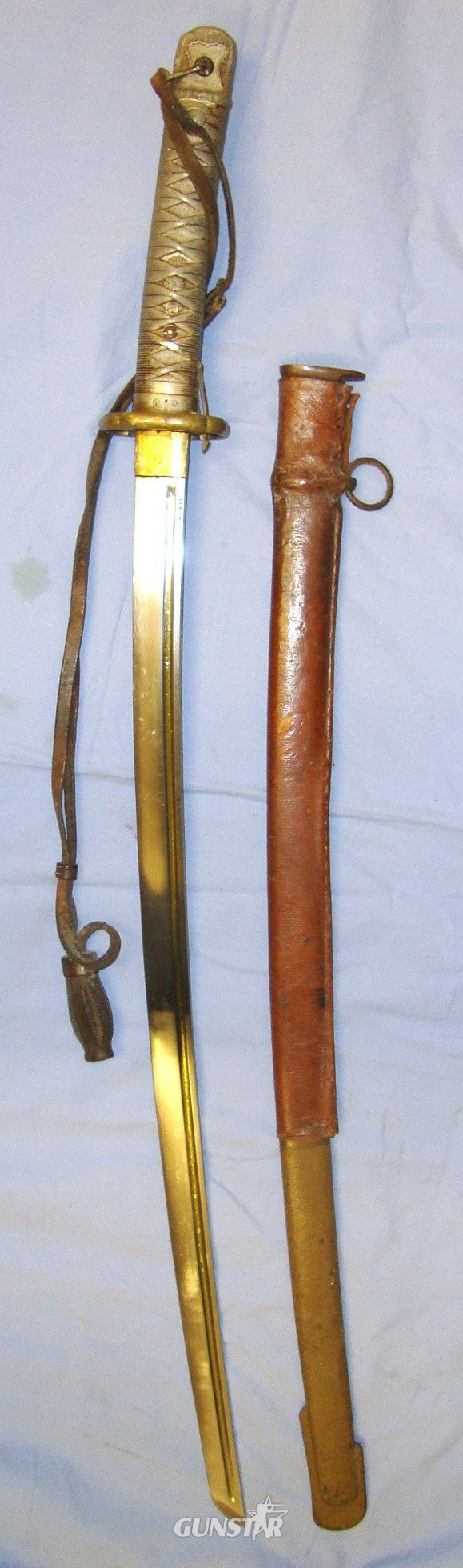 BLADE NUMBERED ON SIDE**WW2 Japanese NCO\'s Type 95 Katana by The Lijima Swords Factory with Kokura Arsenal Mark, Original Leather Cord with Barrel Knot and Scabbard with Part of Its Original leather Field Combat Cover. Sn 20332. Sword in 