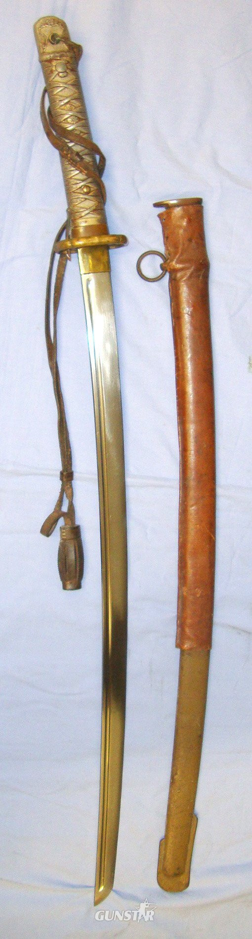  BLADE NUMBERED ON SIDE**WW2 Japanese NCO\'s Type 95 Katana by The Lijima Swords Factory with Kokura Arsenal Mark, Original Leather Cord with Barrel Knot and Scabbard with Part of Its Original leather Field Combat Cover. Sn 20332. Sword