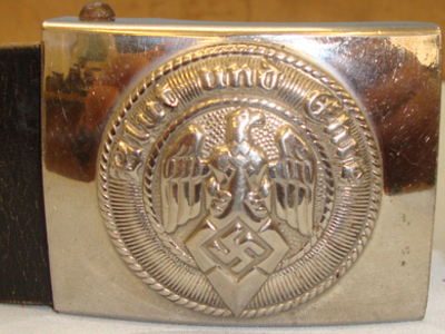 A Hitler Youth HJ Belt and buckle Imprinted ‘Blut Und Ehre’ ‘Blood and Honour’. A Hitler Youth HJ Belt and buckle Imprinted ‘Blut Und Ehre’ ‘Blood and Honour’. Clothing