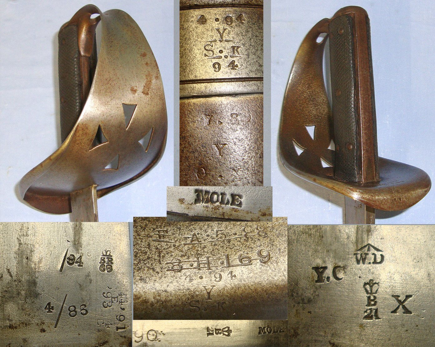 British WD 1885 Pattern Cavalry Troopers Sword By Mole (Birmingham) & WD Scabbard Both With Various Regiment Marks (Some Struck Out) Sn 23174:44 Sword