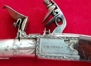 Ref 1808. A good flintlock pocket pistol by J. G. Jones. Circa 1800. Good condition.   Muzzleloader