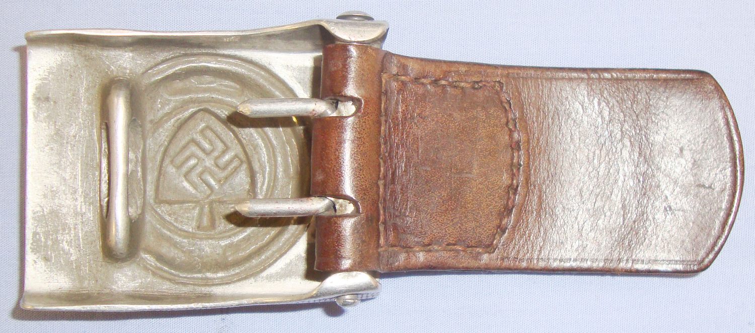  Genuine RAD (Reichsarbeitsdienst) Aluminium Belt Buckle and Leather Tab Dated 1938 by Manufacturer Dransfield & Co Menden. Sn 7607. Genuine RAD (Reichsarbeitsdienst) Aluminium Belt Buckle and Leather Tab Dated 1938 by Manufacturer Dransfield & Co Menden. Sn 7607. Antique & Militaria