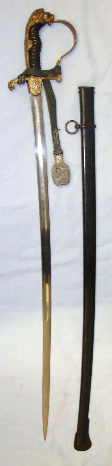  WW1 Era Imperial German Artillery Officer Dress Sword With Lion’s Head ‘Jewelled’ Eyes Pommel Officer’s Cord & Portepee & Scabbard. ED 3021 Sword
