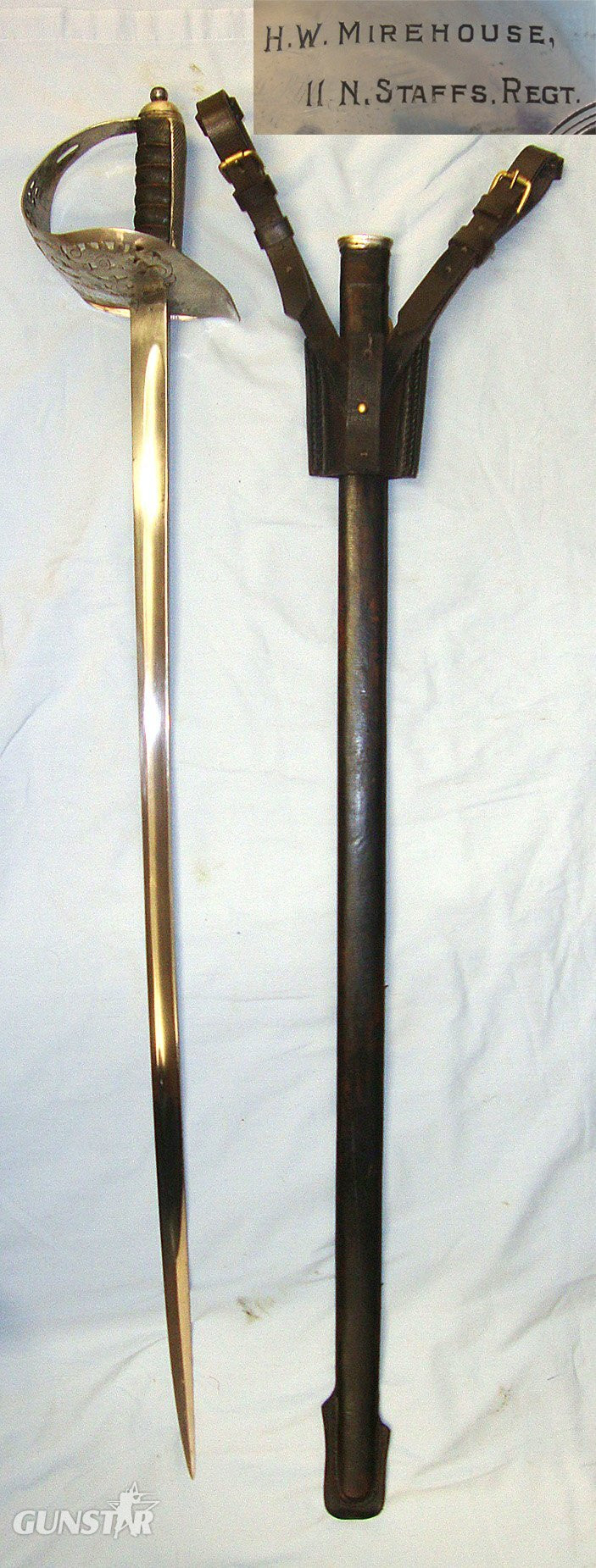 NAMED**Boer War 1901 Dated Blade & WW1 Era British George V 1897 Pattern Sword Guard Engraved To ‘H.W. Mirehouse II N. Staffs Regt’ (2nd Battalion Prince of Wales's (North Staffordshire) Regiment) With Field Service Scabbard & Frog. Sn 23484:88 Sword in 