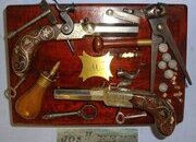 QUALITY**ORNATE SILVER MOUNTED**C1841-1849 Cased Pair Of English Joseph Kemp London 80 Bore Percussion Pocket Pistols With English Proofs, Turn Off Barrels & Original Accessories. Sn 22967:1 percussion pistols Various Muzzleloader