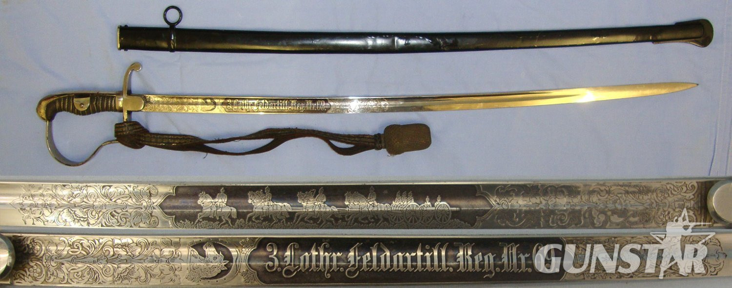 WW1 Era Imperial German Mounted Field Artillery Officer’s Quality Etched & Blued Panels Blade Dress Sword To ‘3 Lothr Feldartill. Reg. Nr 69’ (3rd Battery Field Artillery 69th Regiment) With Bullion Stitched Cord, Portepee & Scabbard. Sn 22871 Sword in 