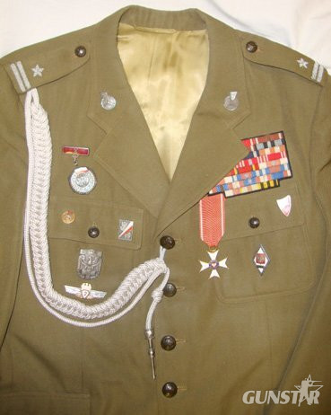 C1960 Cold War Era Polish Officers Uniform Complete with Order of Polonia Restituta Medal, Enamelled Insignia, Ribbons and Cord Aiguillette with Silver Plated Tag. Sn 6953. C1960 Cold War Era Polish Officers Uniform Complete with Order of Polonia Restituta Medal, Enamelled Insignia, Ribbons and Cord Aiguillette with Silver Plated Tag. Sn 6953.  Clothing