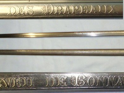 WW1 Era 1913 Dated French Chatellerault Arsenal 1882 Pattern Infantry Officer’s Flag Promotion / Commission Family Presentation Sword With Nickel Plated Brass Hilt, Etched Blade Retailed By Petitfils Paris, Officer’s Rank Tassel Cord & Scabbard. ED 30 Sword