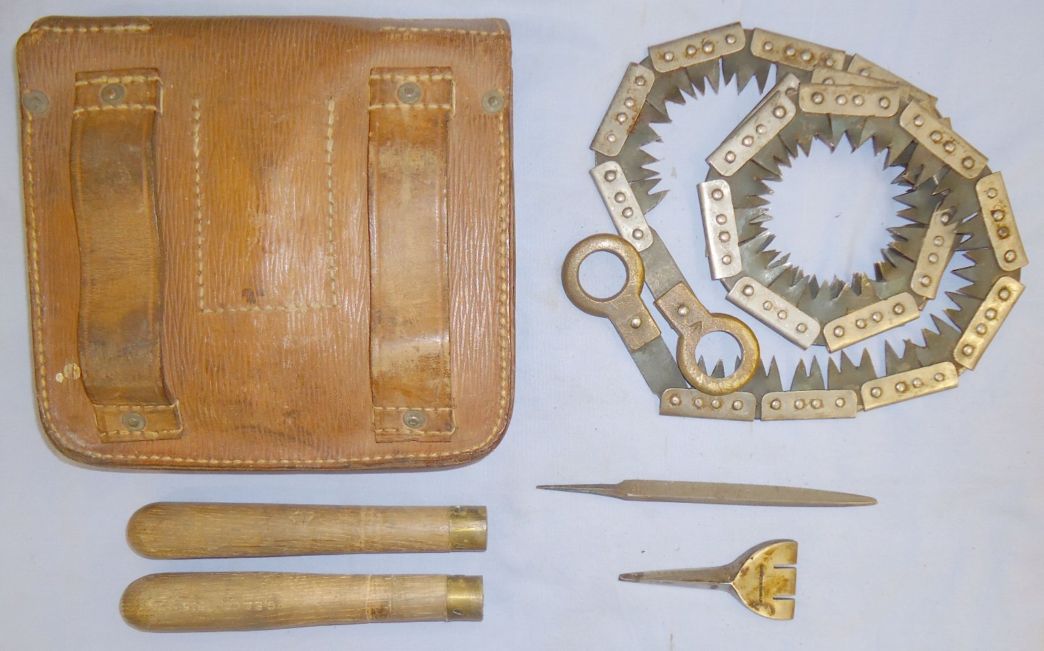 British WWI Folding Saw with File/Setting Tool and Leather Pouch by Francis Wood & Son. MISC 827. British WWI Folding Saw with File/Setting Tool and Leather Pouch by Francis Wood & Son. MISC 827.  Antique & Militaria