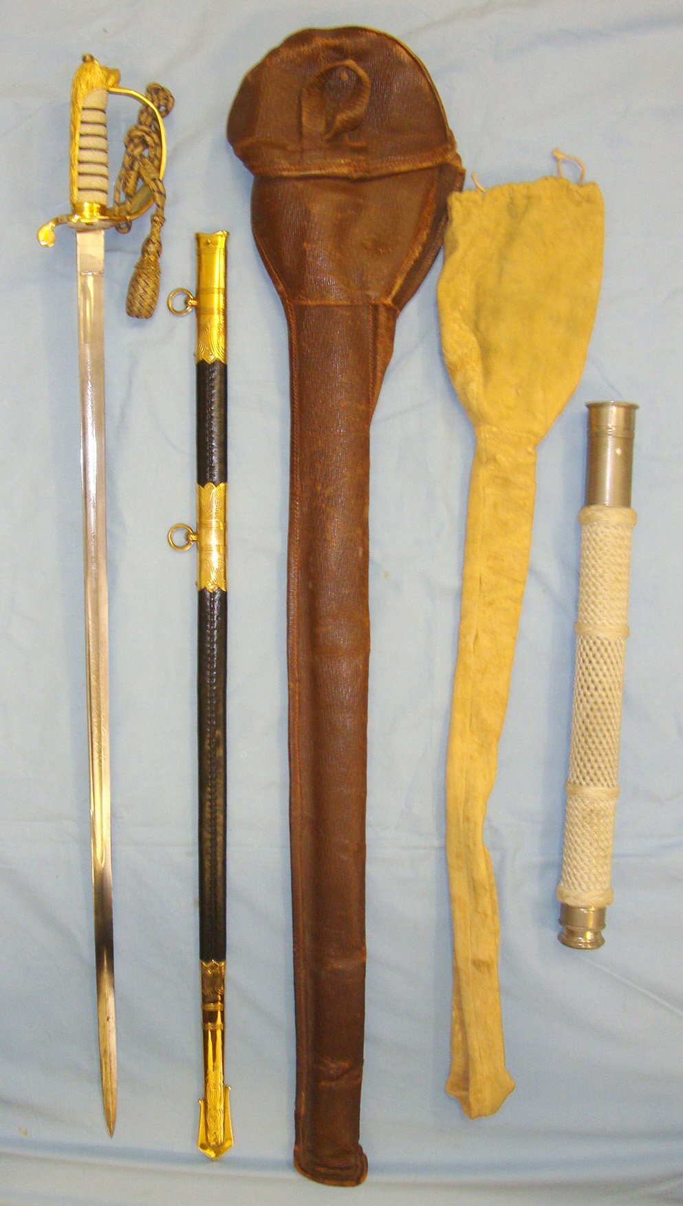  1960 PERSONALLY PRESENTED BY QE II** British Royal Navy Officer’s Sword By Gieves With Etched Presentation Panel To Midshipman William David Spence Kay Smith, Scabbard With Covers & Gieves Midshipman’s Telescope With Similar Presentation Inscription.  Sword