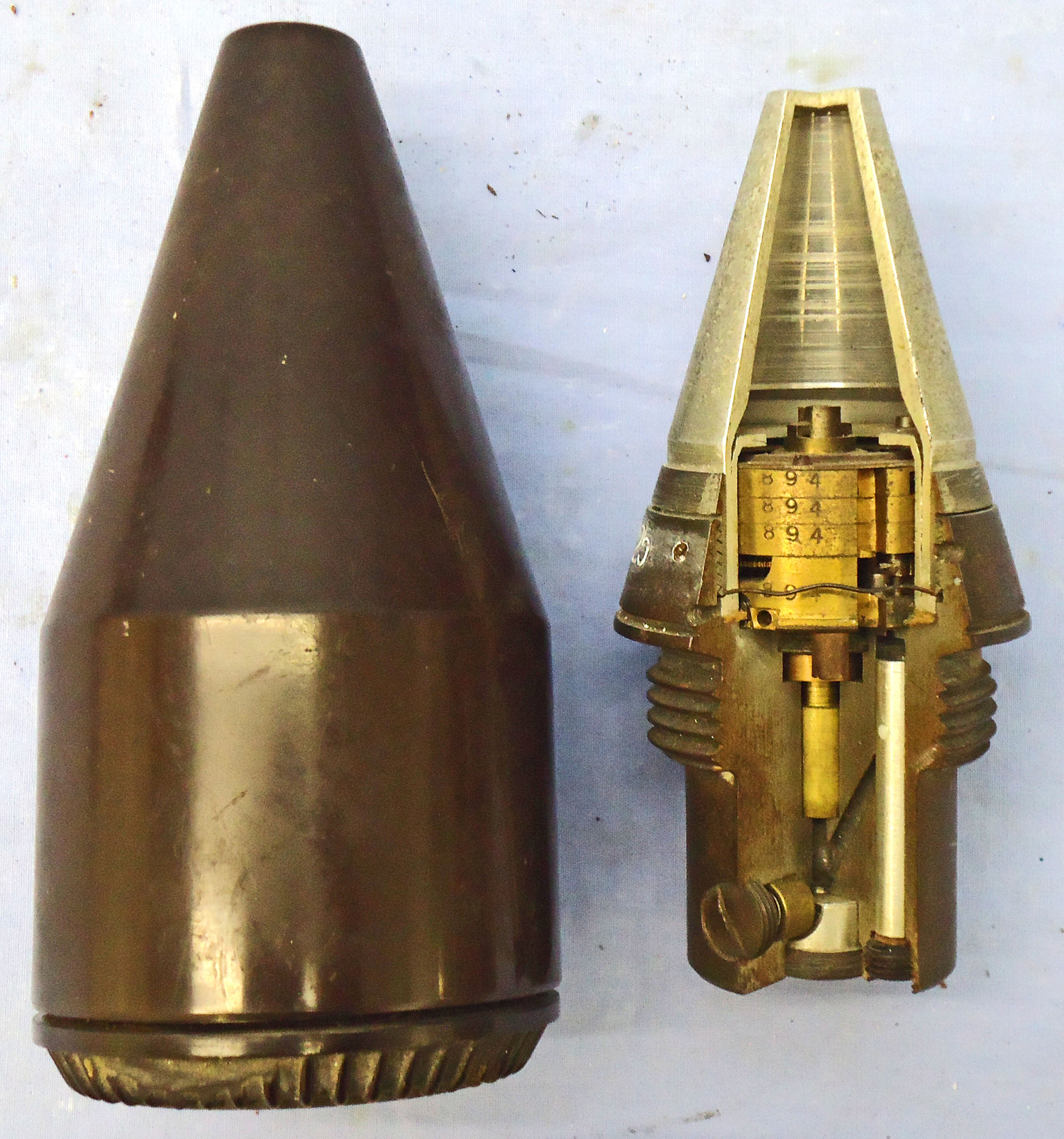 INERT. Very Rare, German, Experimental, 1940 Dated, Factory Sectioned, Railway Gun, Unfired, Dopp Z S45-125 Clockwork Time Fuze In Its Original Bakelite Transit Container. - 21333 INERT. Very Rare, German, Experimental, 1940 Dated, Factory Sectioned, Railway Gun, Unfired, Dopp Z S45-125 Clockwork Time Fuze In Its Original Bakelite Transit Container. - 21333  Other Ammunition - {CATEGORY} in 