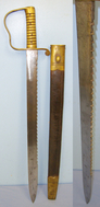 MATCHING MAKER MARKS British WD 1889 Dated 1856 Pattern Mole Birmingham Pioneer’s Saw Back Short Sword Sidearm With Brass Hilt Regiment Marked ‘V.3.N.F’ To The Volunteer Northumberland Fusiliers & 1895 Scabbard By Mole To ‘V.4.SK.’ Suffolk Vols. Sword