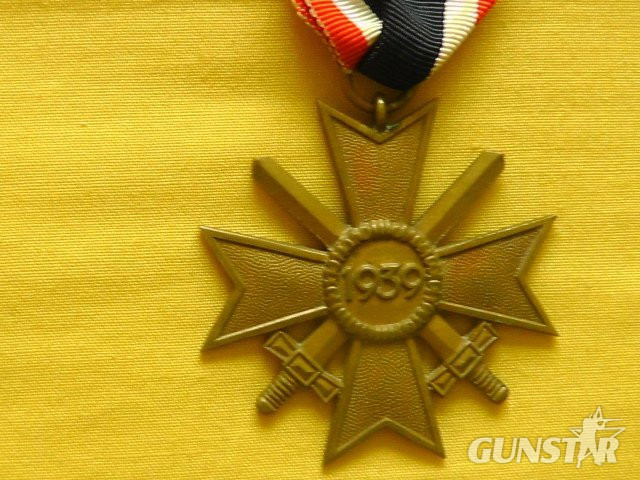  Grossman and Company Early original War Merit Cross second Class with swords and original issue ribbon. Antique & Militaria