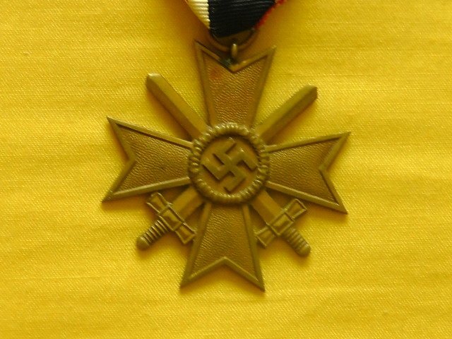 Grossman and Company Early original War Merit Cross second Class with swords and original issue ribbon. Antique & Militaria