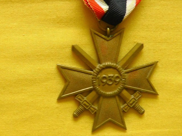  Grossman and Company Early original War Merit Cross second Class with swords and original issue ribbon. Antique & Militaria