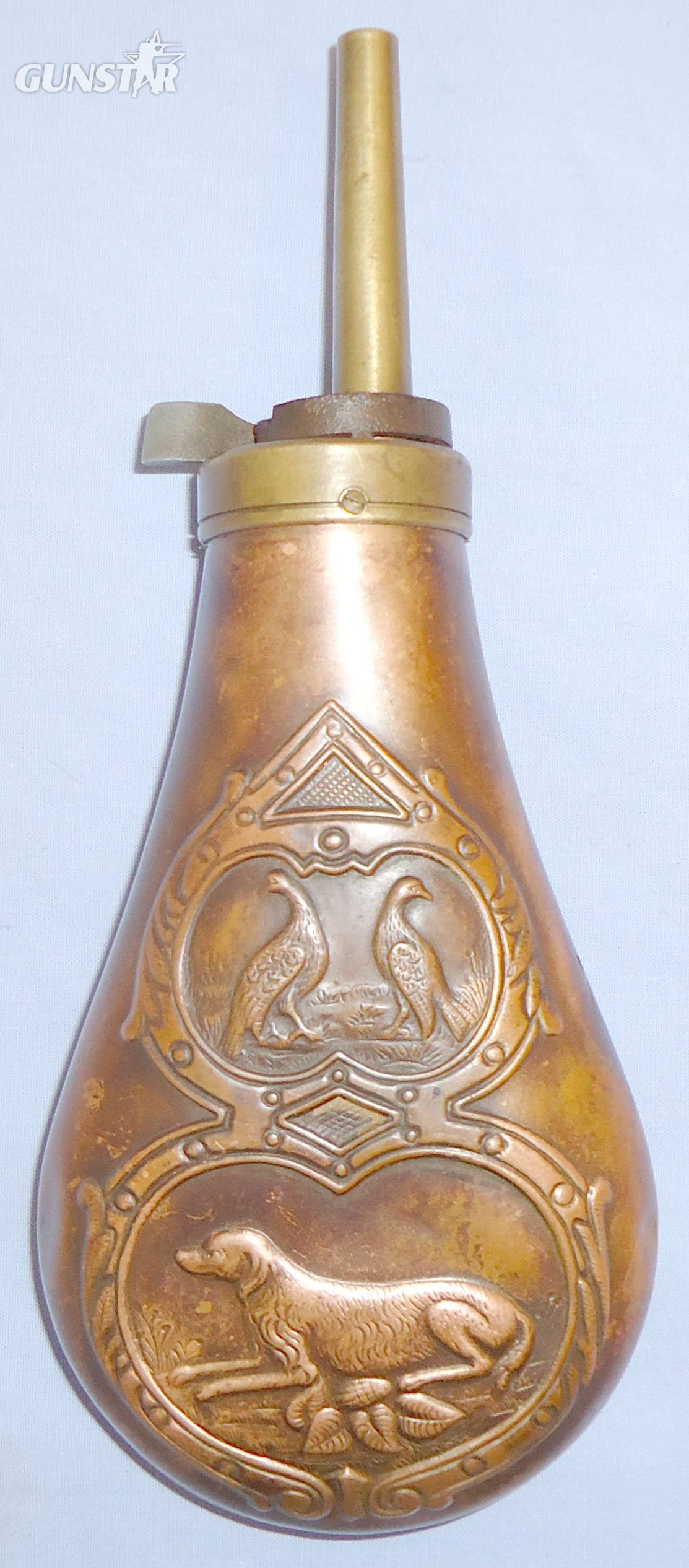 Italian Made Gun Size Embossed Hunting Dog/Grouse Design Copper Black Powder Flask with Sprung Brass Nozzle Charger. 22490:3. Italian Made Gun Size Embossed Hunting Dog/Grouse Design Copper Black Powder Flask with Sprung Brass Nozzle Charger. 22490:3. Other Accessory in 