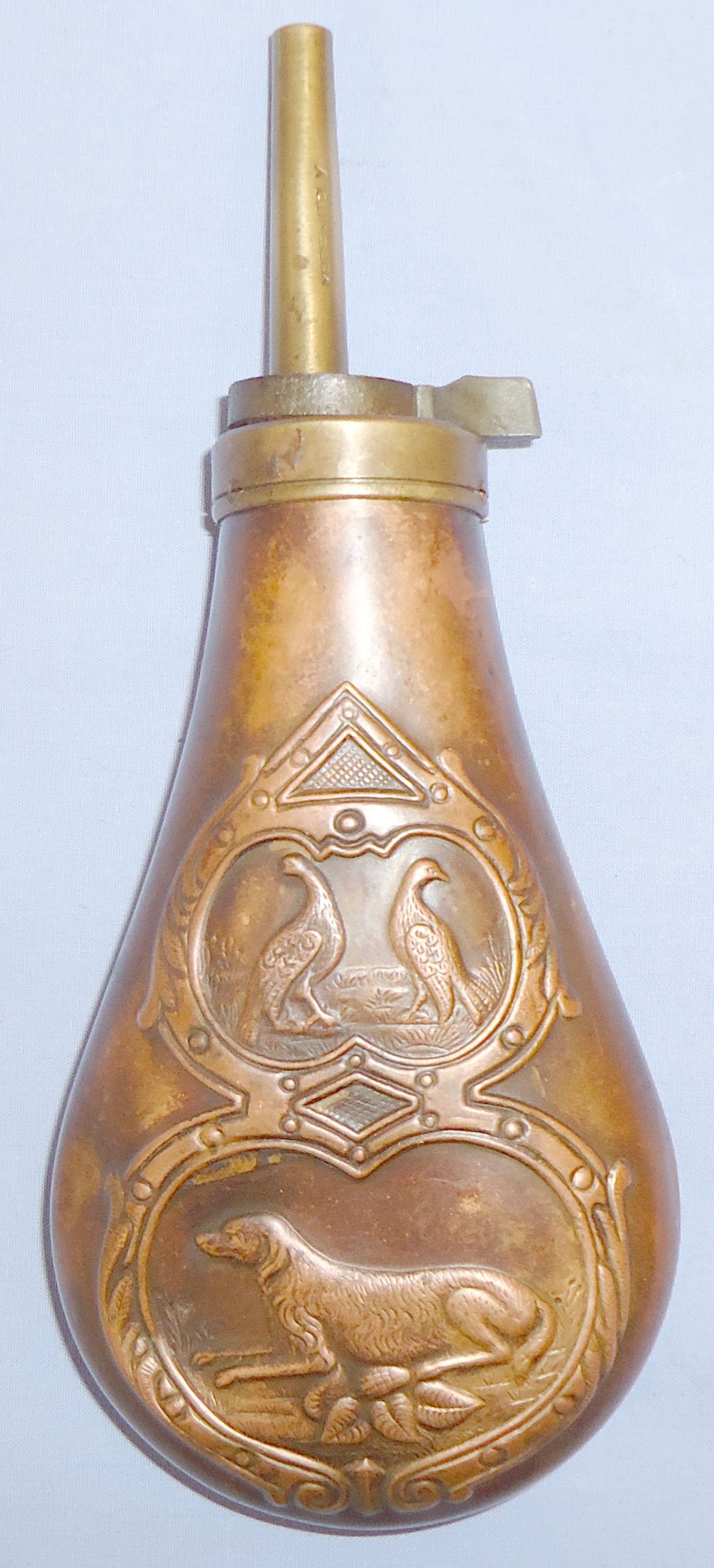  Italian Made Gun Size Embossed Hunting Dog/Grouse Design Copper Black Powder Flask with Sprung Brass Nozzle Charger. 22490:3. Italian Made Gun Size Embossed Hunting Dog/Grouse Design Copper Black Powder Flask with Sprung Brass Nozzle Charger. 22490:3. Other Accessory