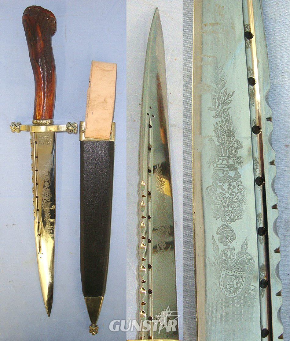  C1950’s Large William Rodgers ‘I Cut My Way’ Sheffield Scottish Highlander's Hunting Dirk Form Spear Point Bowie Knife With One Piece Deer Antler Hilt 'Cairngorm' Jewel Setting, Etched Blade & Leather Covered Wood Scabbard With Brass Mounts. Sn 2350 Knive