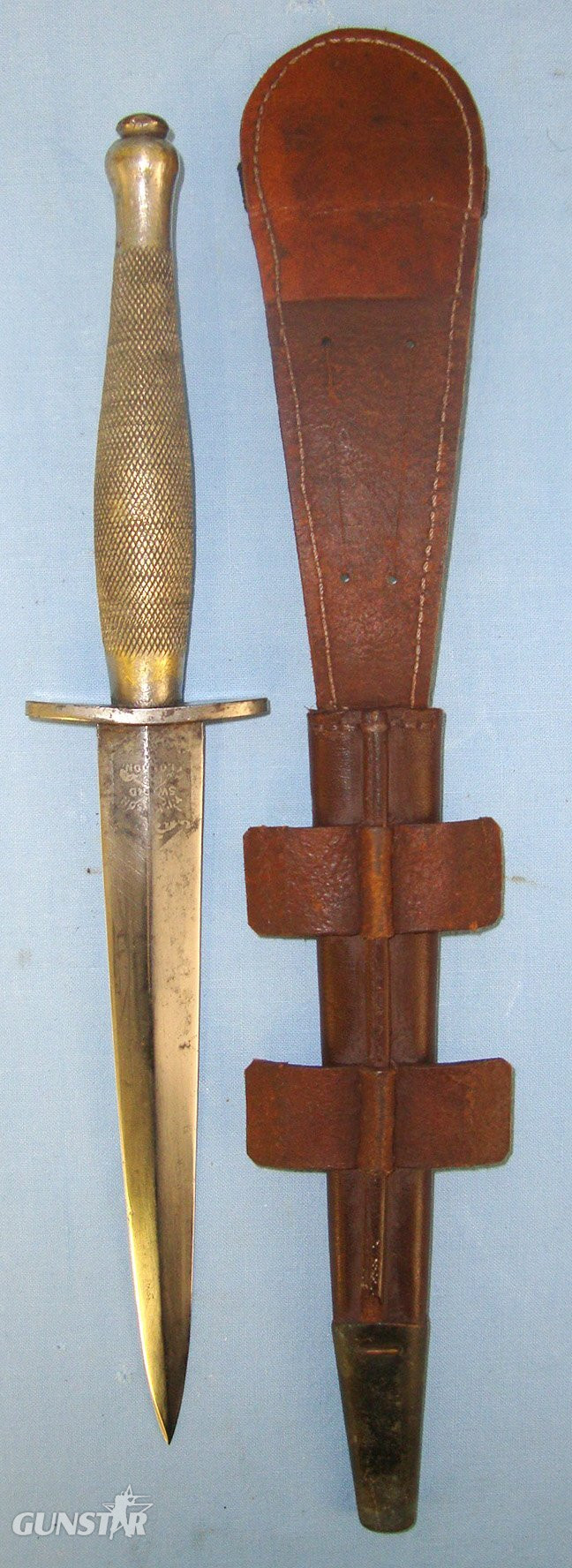  RARE**WW2 American Or Canadian Soldier’s Private Purchase 2nd Pattern Fairbairn Sykes FS Fighting Knife By Wilkinson Sword With Double Etched Panels & Banner To ‘H.Tinfun 1942’ & Scabbard. Sn 21558 Dagger