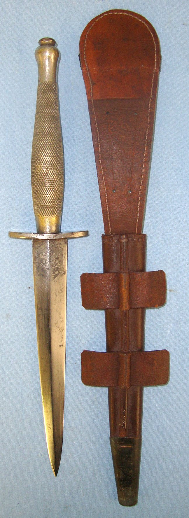  RARE**WW2 American Or Canadian Soldier’s Private Purchase 2nd Pattern Fairbairn Sykes FS Fighting Knife By Wilkinson Sword With Double Etched Panels & Banner To ‘H.Tinfun 1942’ & Scabbard. Sn 21558 Dagger