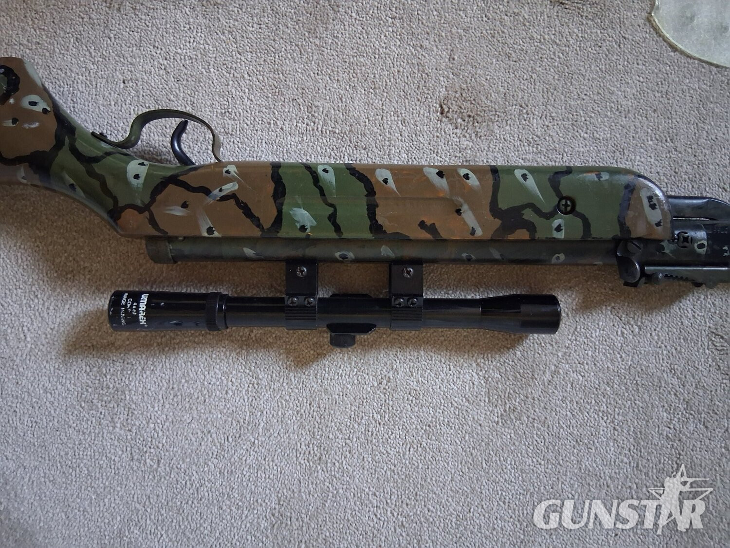 Unknown Camoflage rifle with scope  .22 in 