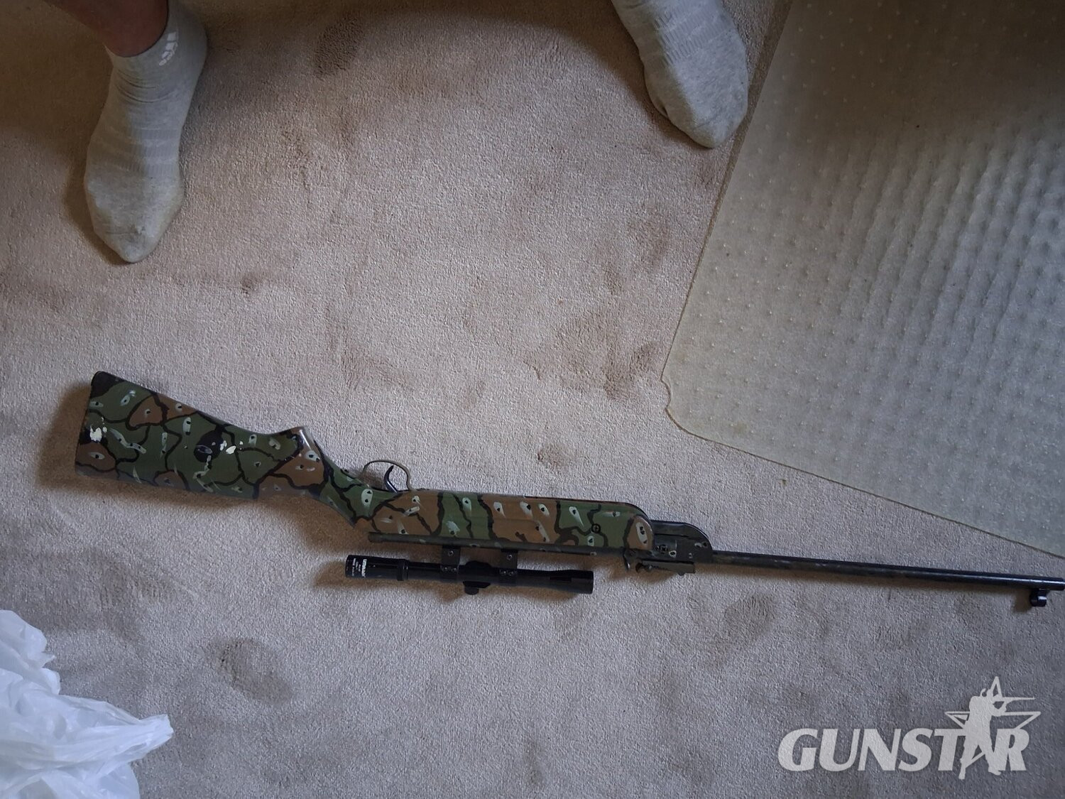 Unknown Camoflage rifle with scope  .22