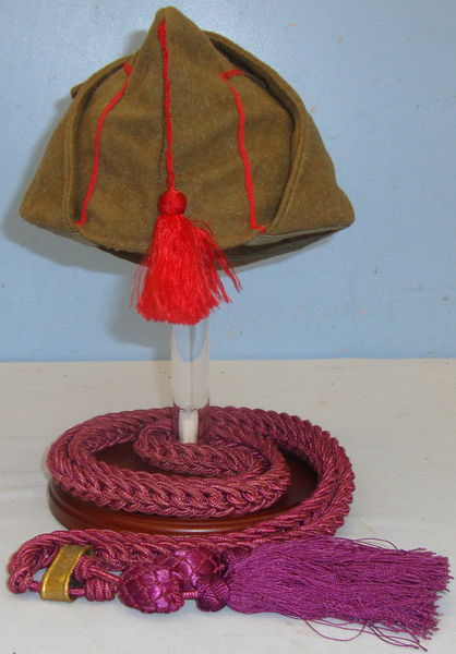  A Spanish garrison ( Gorrillo de Tropa ) Cap with Lanyard and Stand. HE 832. A Spanish garrison ( Gorrillo de Tropa ) Cap with Lanyard and Stand. HE 832. Clothing