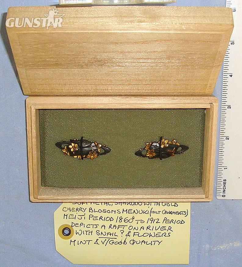 MINT**EXPERT ASSESSED**Sandle Wood Boxed, Matching Pair Of Japanese Meiji Period 1860’s – 1912 Shakudo With Gold Soft Metal Menuki Sword Hilt Ornaments Depicting ‘A Raft On A River With Cherry Blossom Flowers & Snail’. ED 3039 Sword in 
