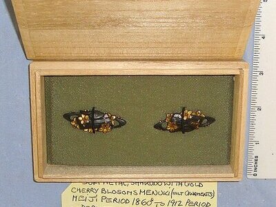 MINT**EXPERT ASSESSED**Sandle Wood Boxed, Matching Pair Of Japanese Meiji Period 1860’s – 1912 Shakudo With Gold Soft Metal Menuki Sword Hilt Ornaments Depicting ‘A Raft On A River With Cherry Blossom Flowers & Snail’. ED 3039 Sword