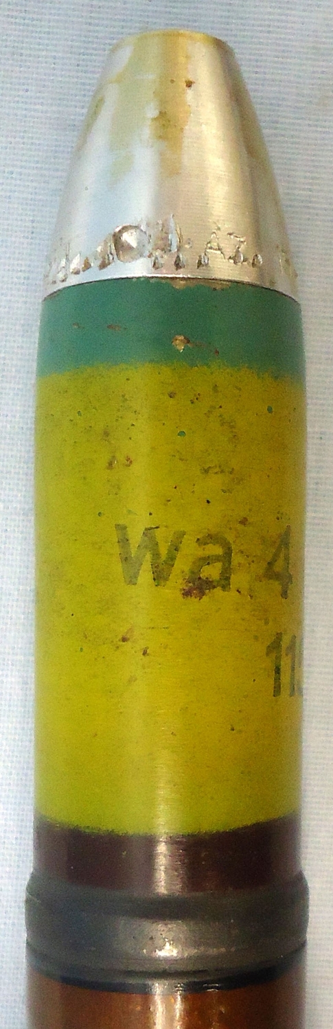 {CATEGORY} - INERT DEACTIVATED. MINT Condition, WW2 1942 Dated 20 mm MK151/20 (20x82) HEI/T (High Explosive Incendiary/Tracer) Cannon Round, Transit Tube & Link. - O 1991 INERT DEACTIVATED. MINT Condition, WW2 1942 Dated 20 mm MK151/20 (20x82) HEI/T (High Explosive Incendiary/Tracer) Cannon Round, Transit Tube & Link. - O 1991  Other Ammunition