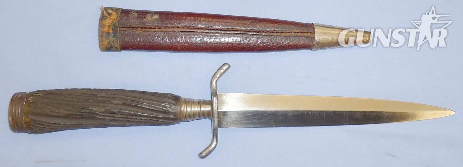  A nice original WWI German trench/fighting knife and steel scabbard. The knife is a hunting style variant and features a carved wood simulated stag-horn hilt (see page 40, plate 177 of Steven\'s book \'Fighting Knives\'). The dagger has a German silver po Dagger