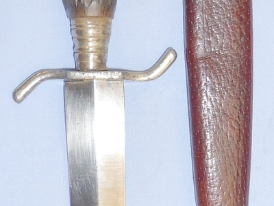 A nice original WWI German trench/fighting knife and steel scabbard. The knife is a hunting style variant and features a carved wood simulated stag-horn hilt (see page 40, plate 177 of Steven\'s book \'Fighting Knives\'). The dagger has a German silver po Dagger