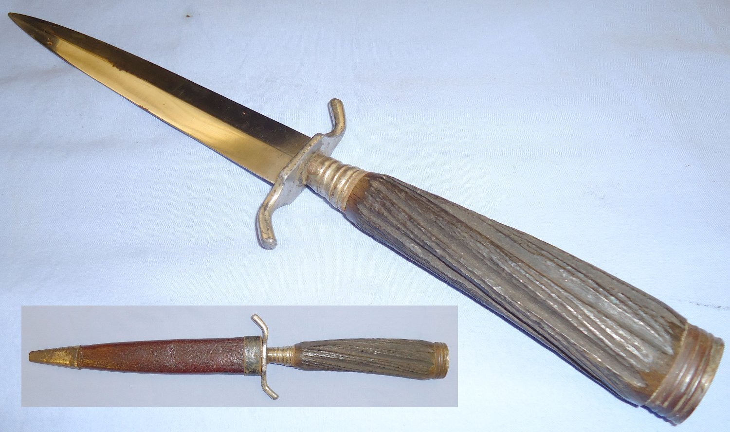 A nice original WWI German trench/fighting knife and steel scabbard. The knife is a hunting style variant and features a carved wood simulated stag-horn hilt (see page 40, plate 177 of Steven\'s book \'Fighting Knives\'). The dagger has a German silver po Dagger