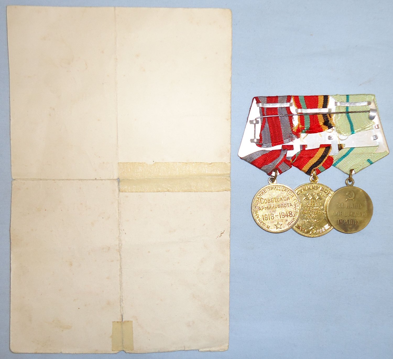  Original Russian WWII Medal Bar Including ‘For the Defence of Stalingrad’ Medal, Jubilee Medal for 30 Years of Victory in Great Patriotic War and Jubilee Medal \"30 Years of the Soviet Army and Navy\" with Officially Stamped Presentation Certificate.  Original Russian WWII Medal Bar Including ‘For the Defence of Stalingrad’ Medal, Jubilee Medal for 30 Years of Victory in Great Patriotic War and Jubilee Medal \"30 Years of the Soviet Army and Navy\" with Officially Stamped Presentation Certificate.  Antique & Militaria