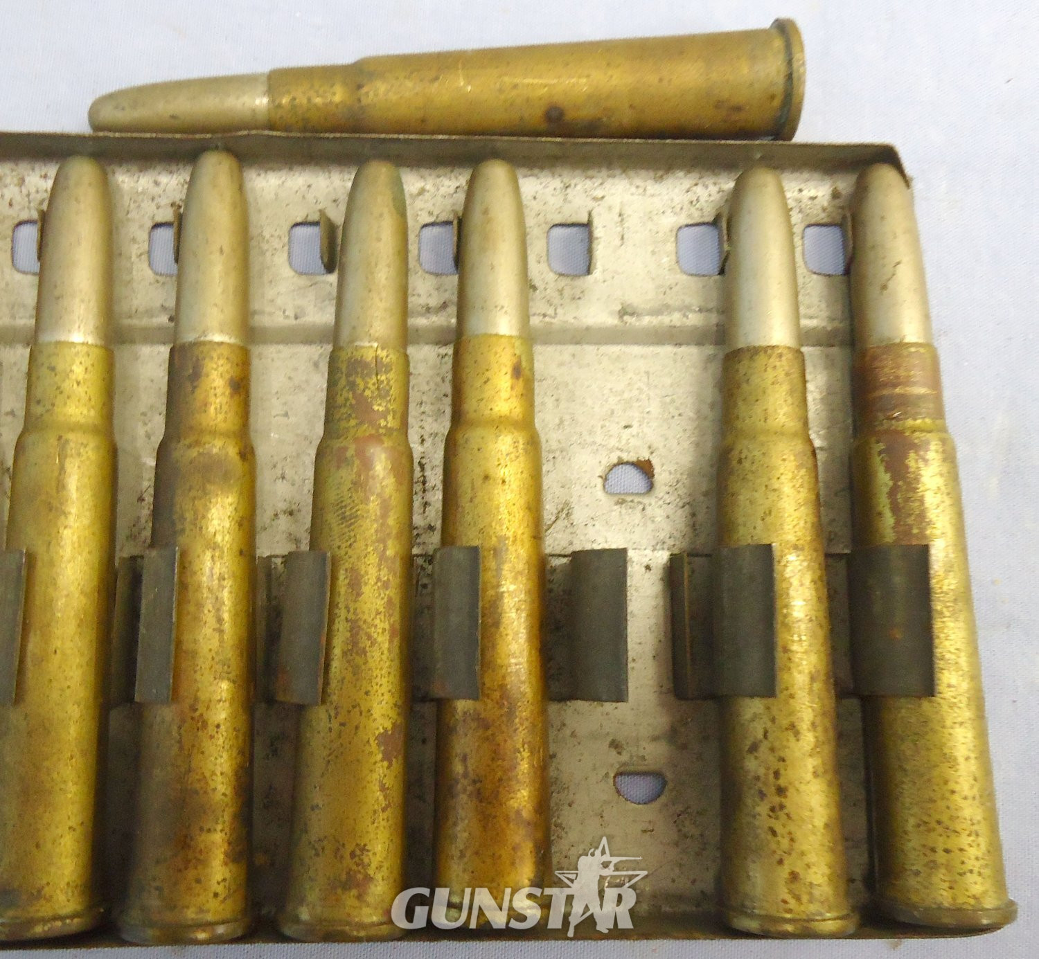 {CATEGORY} - INERT DEACTIVATED. RARE, British, Experimental, 25 Round .303 Feed Strip for the British Model 1893 Gatling Gun. - O 2283 INERT DEACTIVATED. RARE, British, Experimental, 25 Round .303 Feed Strip for the British Model 1893 Gatling Gun. - O 2283 Various Other Ammunition in 