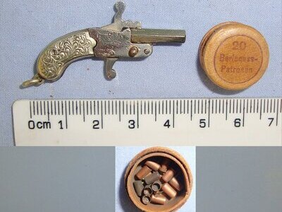MINIATURE**EXPERTLY CRAFTED**German / Austrian Late 19th Century Break Action Pin Fire Metal Pistol With German Silver Grips & Period Ammunition Box Containing A Small Quantity Of 1mm Pin Fire Blank Cartridges. Sn 23708:2  miniature pin fire pistol  Obsolete Single Shot